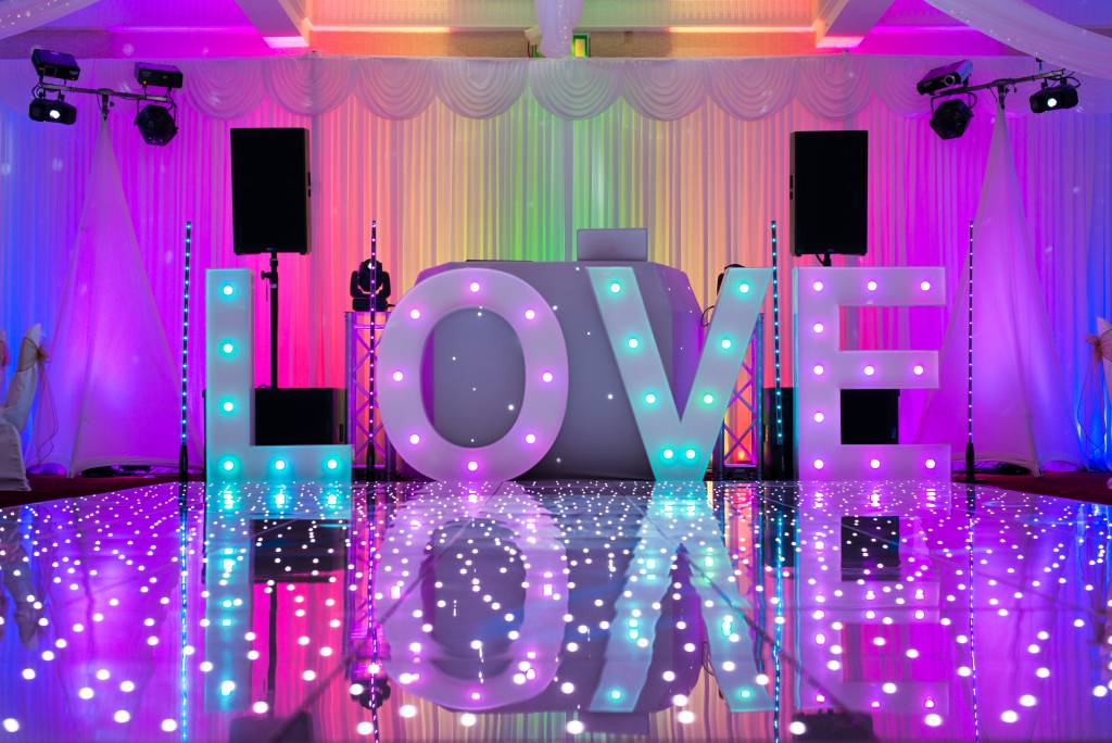 Image of light up LOVE letters on a wedding dancefloor